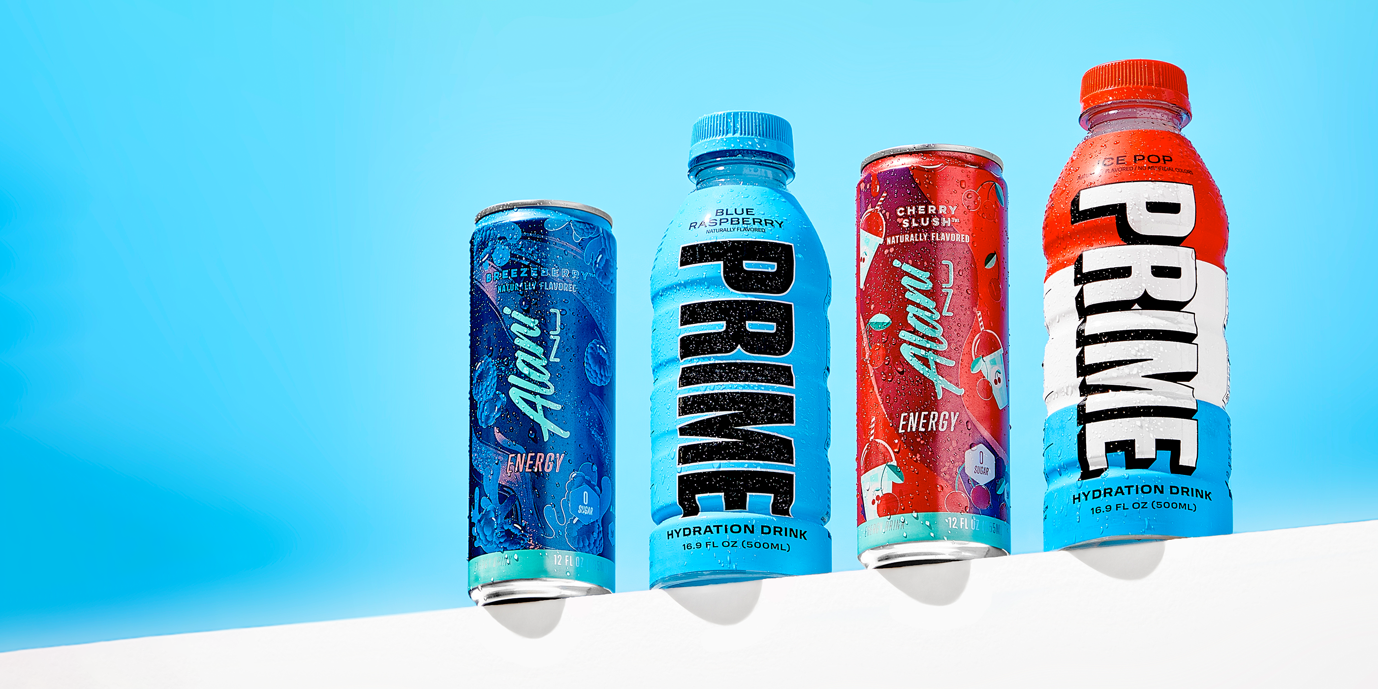  Displayed side by side are four refreshment options: a Breezberry energy drink, Prime Hydration in Blue Raspberry, a Cherry Slush-flavored energy drink, and Prime Hydration featuring the Rocket Pop flavor.