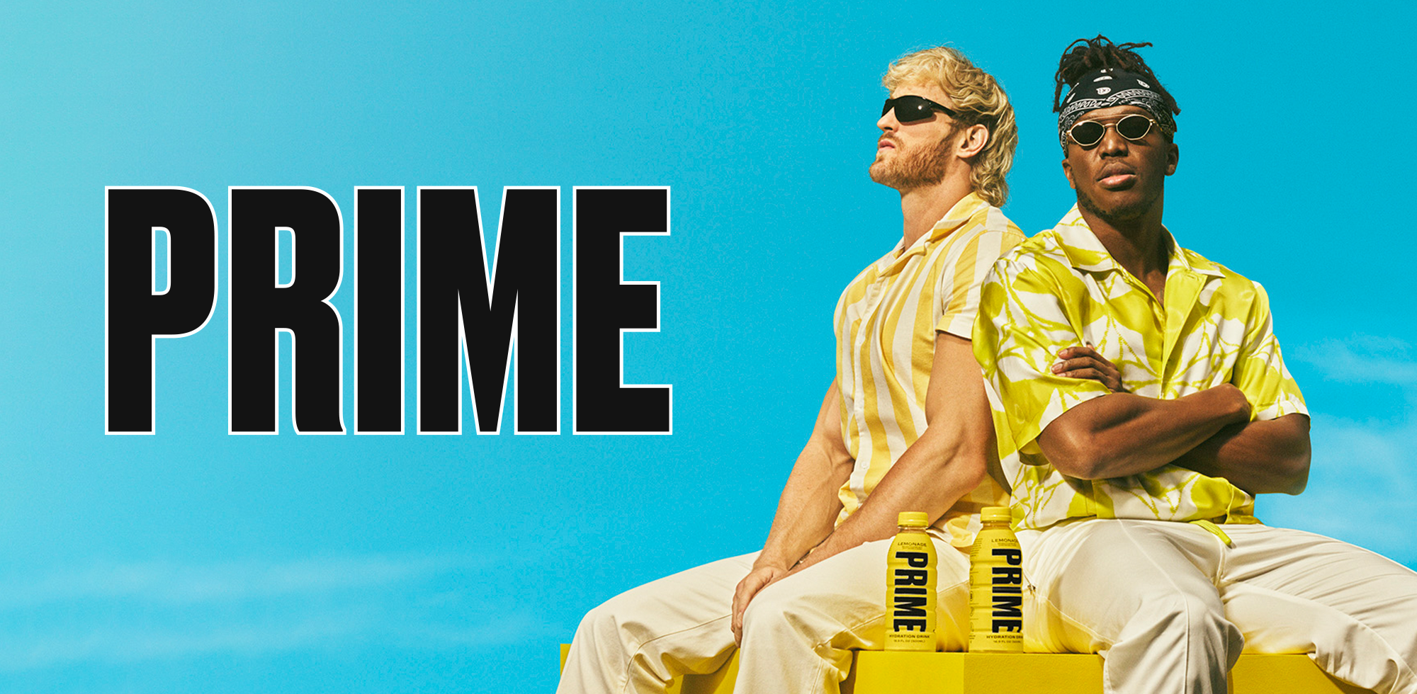 KSI and Logan Paul wearing sunglasses and yellow-striped shirts, seated back-to-back with a serious demeanor, above two bottles of 'PRIME' hydration drink, against a bright blue sky.